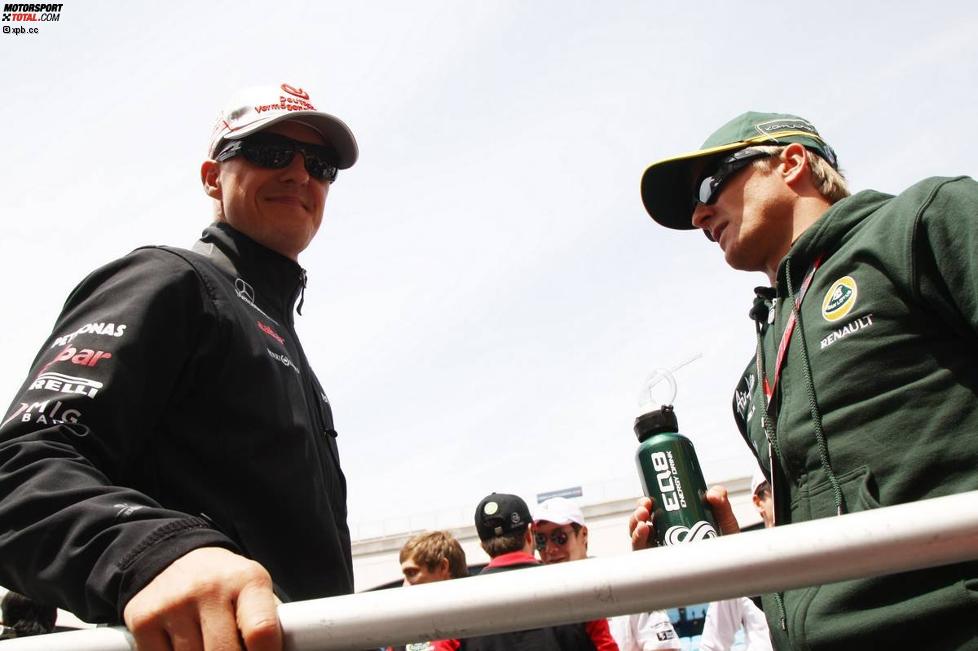 Michael Schumacher und Heikki Kovalainen (Lotus) 