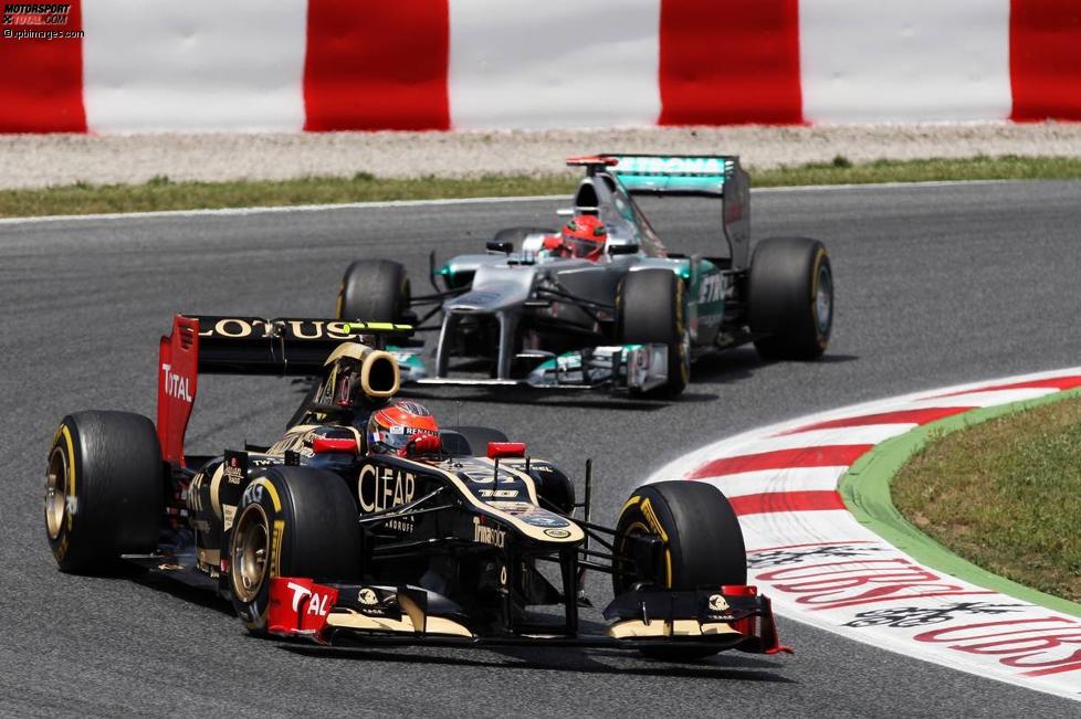 Romain Grosjean (Lotus) und Michael Schumacher (Mercedes) 