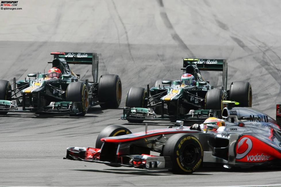 Lewis Hamilton (McLaren), Heikki Kovalainen (Caterham) und Witali Petrow (Caterham) 