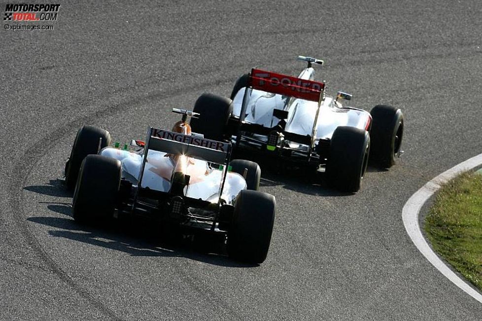 Nico Hülkenberg (Force India) und Lewis Hamilton (McLaren) 