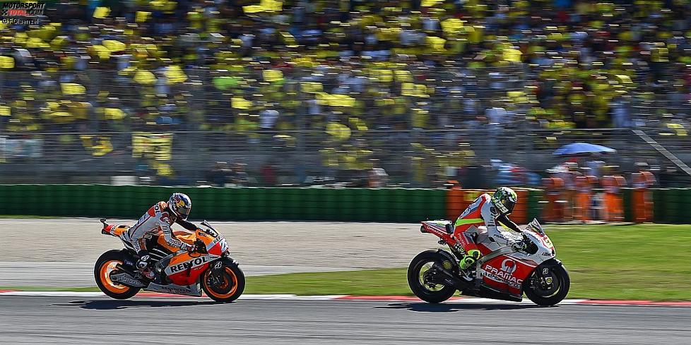 Andrea Iannone vor Daniel Pedrosa 