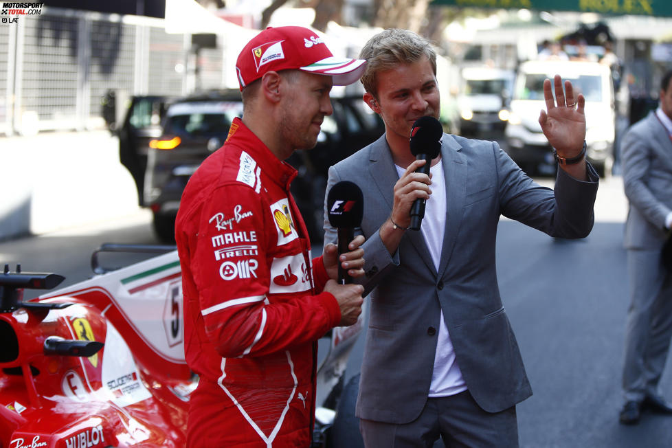 Sebastian Vettel (Ferrari) und Nico Rosberg 