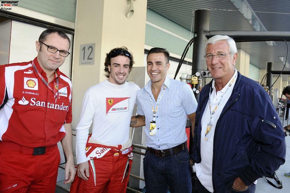 Hoher Fußball-Besuch bei Ferrari: Teamchef Stefano Domenicali mit Fernando Alonso, Fabio Cannavaro und Marcello Lippi.