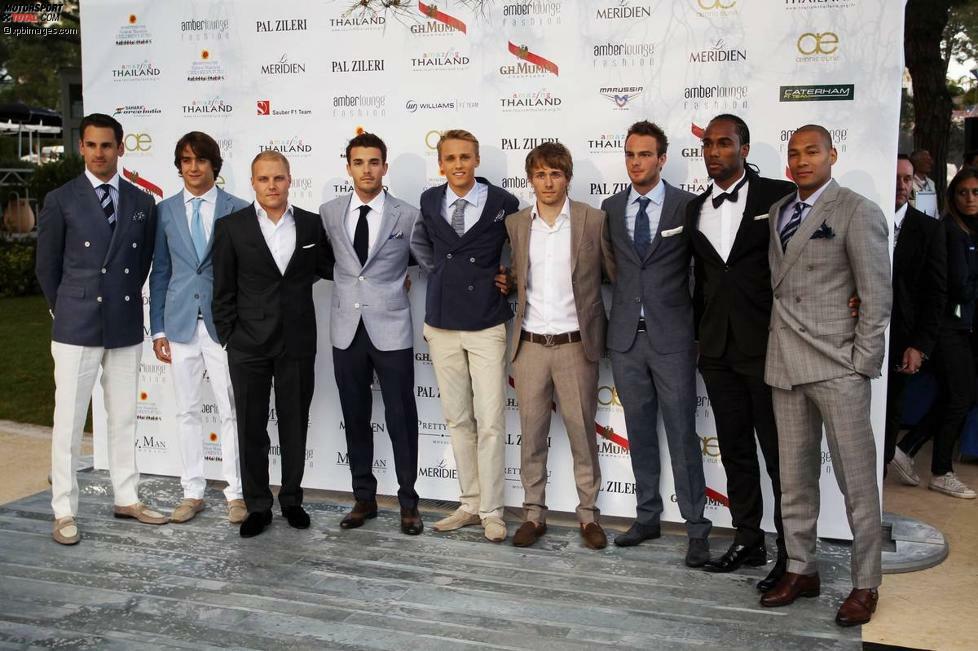 Aber auch die Fahrer selbst machen in modischen Anzügen gute Figur. Von links nach rechts: Adrian Sutil, Esteban Gutierrez, Valtteri Bottas, Jules Bianchi, Max Chilton, Charles Pic, Giedo van der Garde sowie die Fußballer Cameron Jerome und Damian Batt.