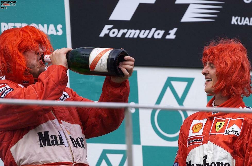 2000 platzte endlich der Knoten, und Michael Schumacher holte mit Ferrari endlich den lange ersehnten WM-Titel. Bei der Feier auf dem Siegespodest in Sepang trugen die Ferrari-Triumphatoren rote Perücken, und auch Brawn gönnte sich einen Schluck Champagner. Damit begann in der Formel 1 die