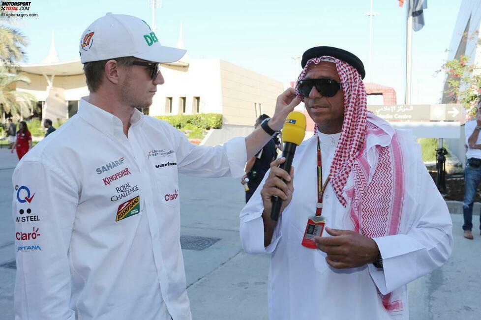 Vor dem Rennen: Nico Hülkenberg rückt bei Kai Ebel, natürlich in landestypischer Kluft unterwegs (und damit besser angezogen als sonst, wie böse Zungen unken), den Sonnenschutz zurecht.