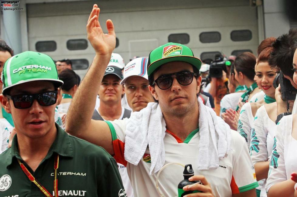 Für Sergio Perez ist der Rennsonntag schon vorbei, noch bevor er richtig anfängt. Wovon er bei der Fahrerparade noch nichts ahnt: Sein Force India schafft es wegen einer fehlerhaften Getriebesoftware nicht einmal in die Startaufstellung.