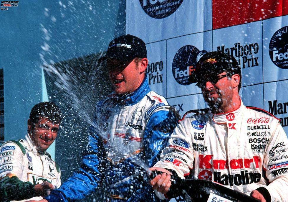 Homestead 1999: Greg Moore feiert seinen letzten Sieg. Mit auf dem Podium sind Dario Franchitti und Michael Andretti.
