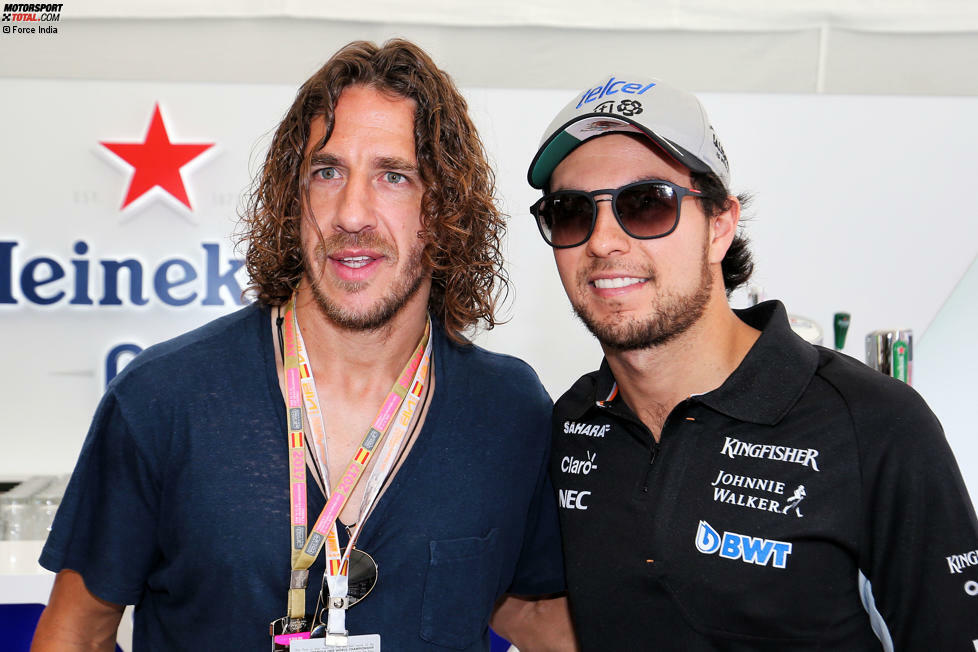 Carles Puyol ist eine lebende Legende des FC Barcelona und stattet dem Grand Prix von Spanien nicht zum ersten Mal einen Besuch ab. Eingefädelt übrigens von Formel-1-Sponsor Heineken. Hier im Bild mit Force-India-Fahrer Sergio Perez.