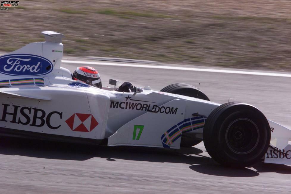 Neben Champion Michael Schumacher ist der Brite bei Benetton 1995 ganz klar die Nummer zwei. Trotzdem fährt er seine ersten beiden Siege in der Formel 1 ein. Es folgen drei sieglose Jahre bei Sauber, bevor er 1999 für Stewart noch ein drittes und letztes Mal triumphiert. Auf dem Nürburgring profitiert er von chaotischen Bedingungen.