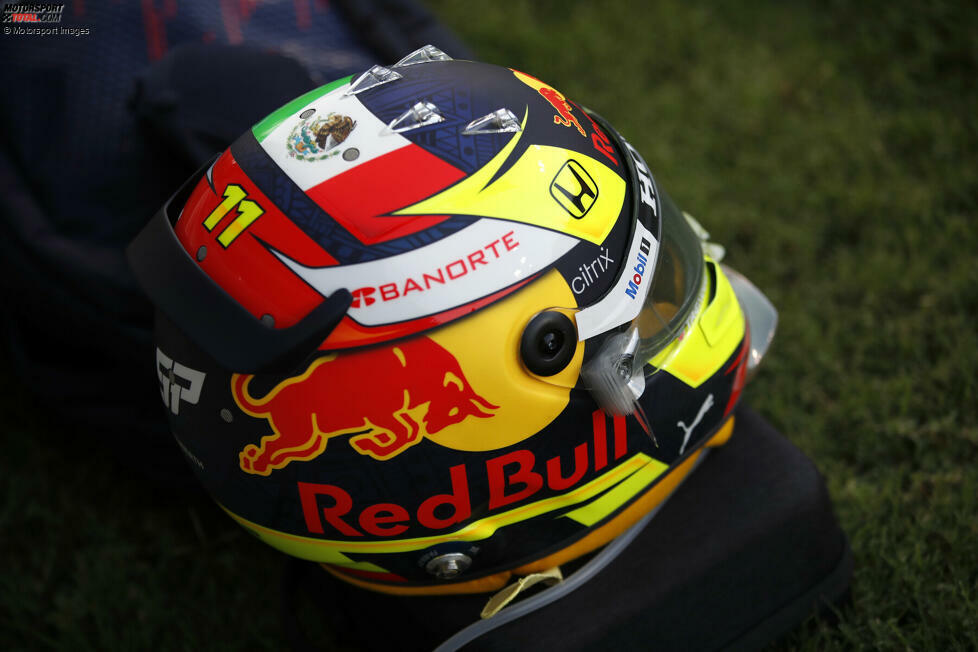 Das war der Helm von Sergio Perez 2012 bei Sauber. Ein bisschen Gelb ist immer noch übrig, 2021 dominieren jedoch vor allem die Red-Bull-Farben und das Logo des Getränkeherstellers.