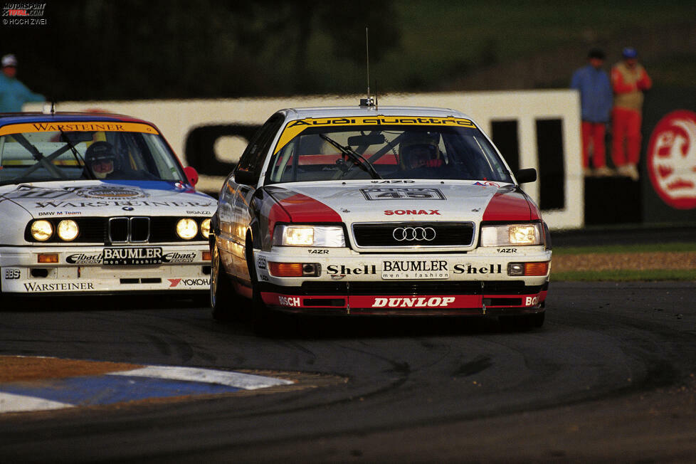 1990 bis 1992: Audi revolutioniert die DTM mit dem Einsatz eines V8-Motors und Allradantrieb. Der Audi V8 quattro gewinnt zwei Jahre in Folge die Meisterschaft und prägt die Serie mit seiner technischen Überlegenheit. In der Saison 1992 wird die Kurbelwelle von Audi verboten und die Ingolstädter ziehen sich mit sofortiger Wirkung zurück.