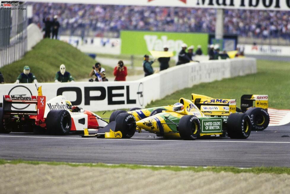 Magny-Cours 1992: In der ersten Rennrunde kollidiert Michael Schumacher im Benetton mit Ayrton Senna im McLaren - aber nur Senna fällt aus. Dafür setzt es eine Standpauke von Senna noch vor dem Restart.