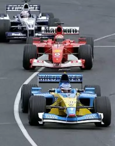Titel-Bild zur News: Juan-Pablo Montoya, Michael Schumacher und Jarno Trulli im Kampf um die Plätze