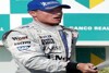 Bild zum Inhalt: Coulthard auf dem Podium - Räikkönen im Kies