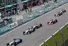 Bild zum Inhalt: Jarno Trulli im Windschatten von Schumacher