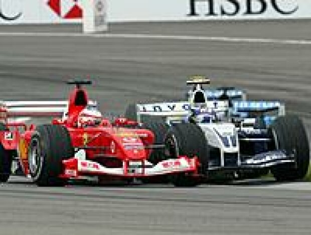 Titel-Bild zur News: Rubens Barrichello und Juan-Pablo Montoya kollidieren