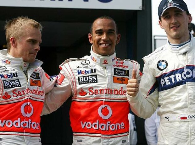Titel-Bild zur News: Heikki Kovalainen, Lewis Hamilton und Robert Kubica