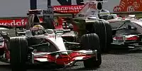 Bild zum Inhalt: Dennis steht hinter Hamilton