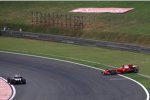 Kimi Räikkönen (Ferrari) dreht sich auf feuchter Piste