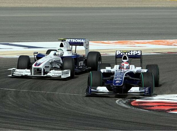 Kazuki Nakajima vor Nick Heidfeld