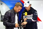Lukas Podolski und Robert Kubica (BMW Sauber F1 Team) 