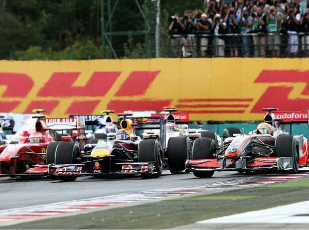 Kimi Räikkönen, Mark Webber und Lewis Hamilton Kimi Räikkönen, Mark Webber und Lewis Hamilton