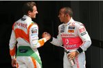 Adrian Sutil (Force India) und Lewis Hamilton (McLaren-Mercedes) feiern