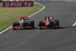 Heikki Kovalainen (McLaren-Mercedes) quetscht sich an Giancarlo Fisichella (Ferrari) vorbei