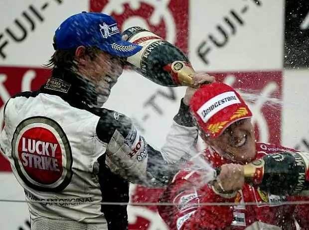 Michael Schumacher, Jenson Button 2004 Titel-Bild zur News: Michael Schumacher, Jenson Button 2004