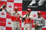 Jenson Button (McLaren), Lewis Hamilton (McLaren) und Nico Rosberg (Mercedes) 