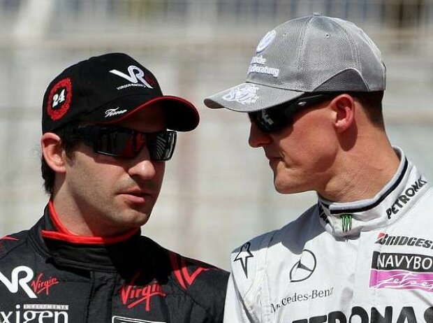 Titel-Bild zur News: Timo Glock und Michael Schumacher