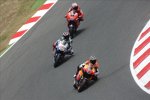 Andrea Dovizioso (Honda), Jorge Lorenzo (Yamaha) und Casey Stoner (Ducati)