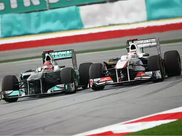 Michael Schumacher und Kamui Kobayashi Titel-Bild zur News: Michael Schumacher und Kamui Kobayashi