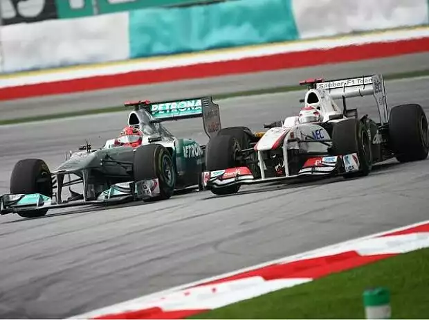 Titel-Bild zur News: Michael Schumacher und Kamui Kobayashi