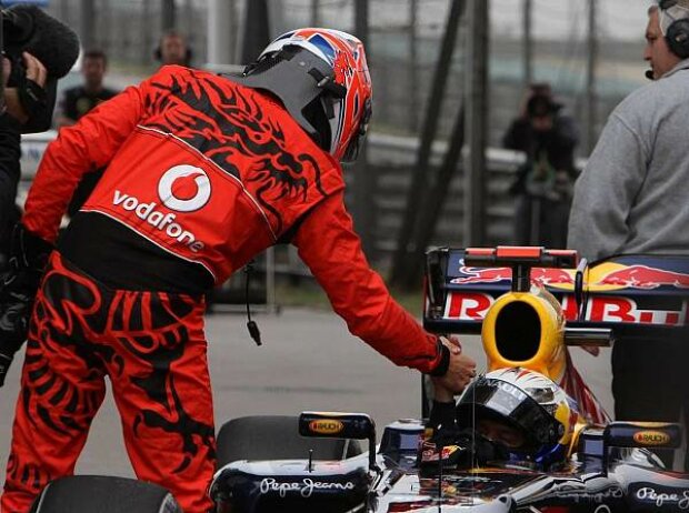 Titel-Bild zur News: Sebastian Vettel, Jenson Button
