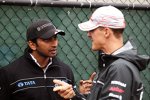 Narain Karthikeyan (HRT) und Michael Schumacher (Mercedes) 