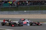 Witali Petrow (Renault) und Jenson Button (McLaren) 