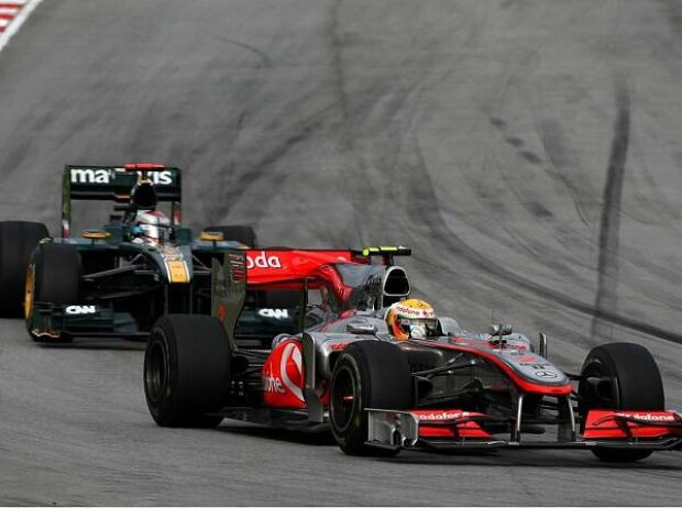 Lewis Hamilton, Jarno Trulli Lewis Hamilton, Jarno Trulli