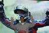 Bild zum Inhalt: Weltmeister Vettel erweist seinem Team die Ehre