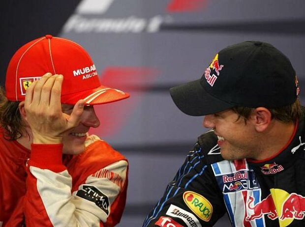 Titel-Bild zur News: Kimi Räikkönen und Sebastian Vettel