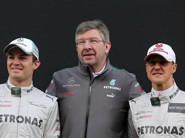 Titel-Bild zur News: Nico Rosberg, Ross Brawn (Teamchef), Michael Schumacher
