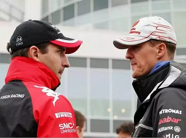 Michael Schumacher, Timo Glock Titel-Bild zur News: Michael Schumacher, Timo Glock