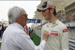 Bernie Ecclestone (Formel-1-Chef) mit Romain Grosjean (Lotus) 