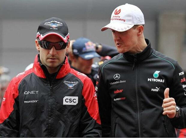 Titel-Bild zur News: Timo Glock und Michael Schumacher