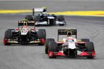 Narain Karthikeyan (HRT) und Romain Grosjean (Lotus) 