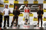 Lewis Hamilton (McLaren), Romain Grosjean (Lotus) und Kimi Räikkönen (Lotus) 