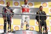 Bild zum Inhalt: Button und Vettel jubeln, Räikkönen enttäuscht