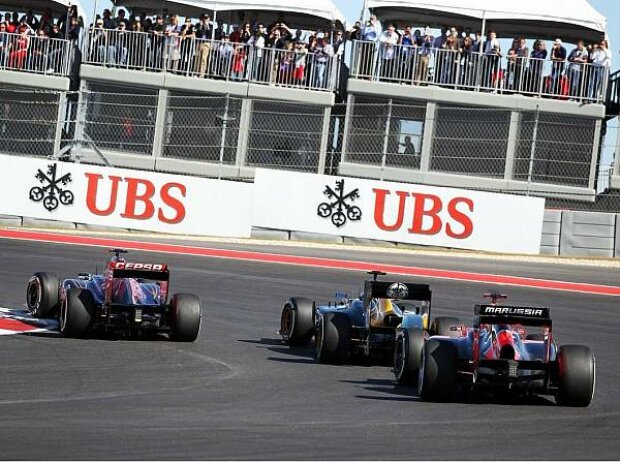 Daniel Ricciardo, Witali Petrow, Timo Glock Daniel Ricciardo, Witali Petrow, Timo Glock