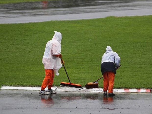 Kehrende Streckenarbeiter Kehrende Streckenarbeiter